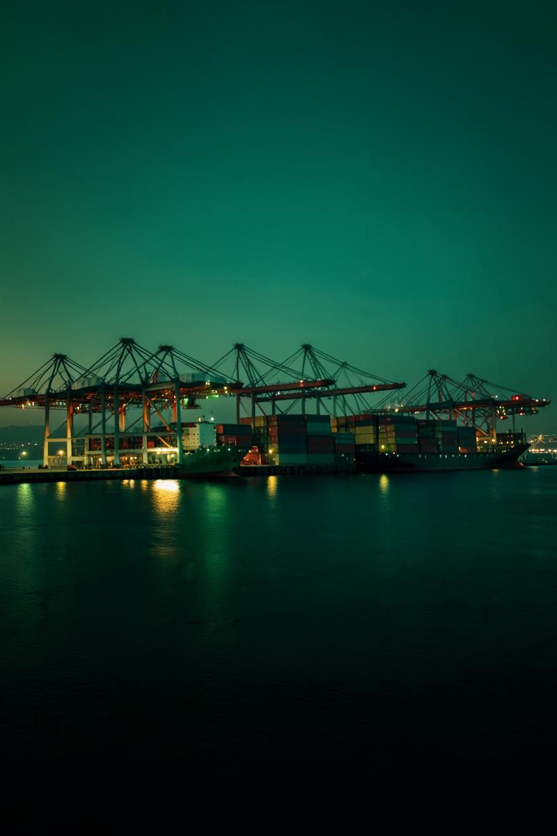 Modern Asian and Middle Eastern port infrastructure at dusk